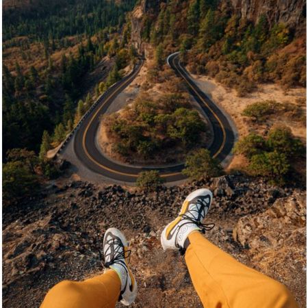 Person sitting on the edge of a cliff by https://unsplash.com/@karsten116